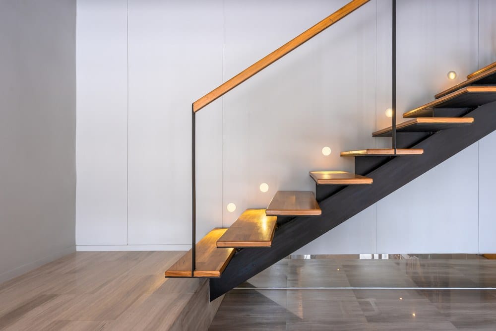 modern stairs with glass panel and wooden hand rails