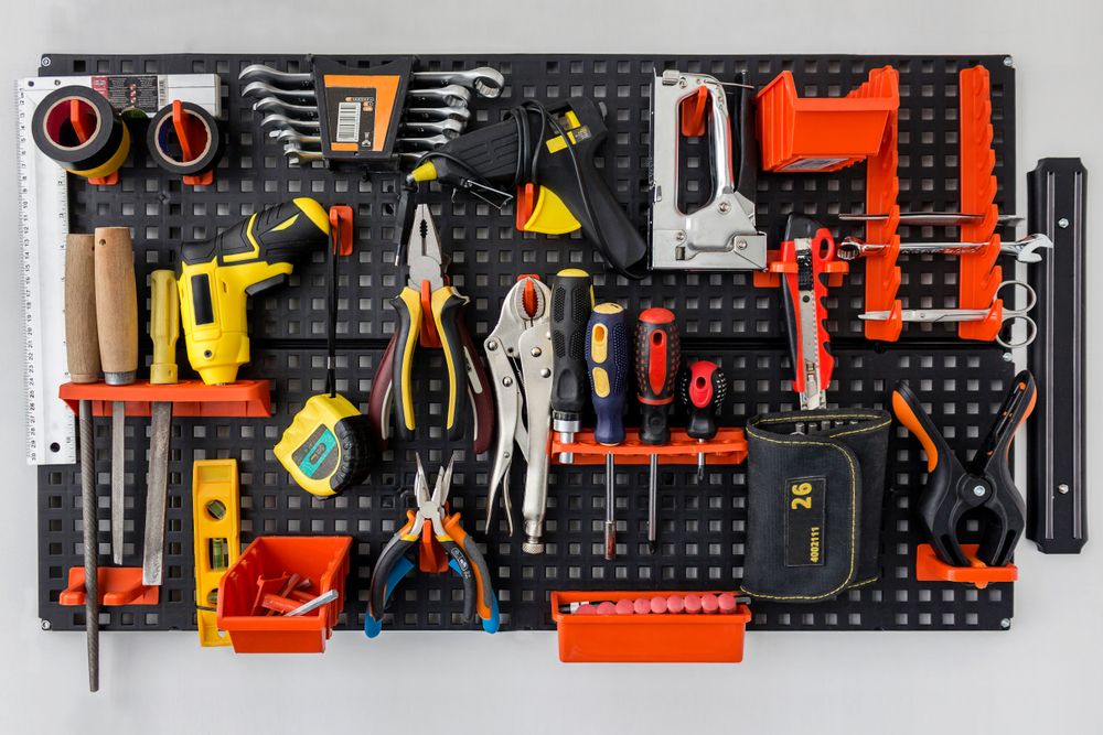 Various tools stored on a pegboard
