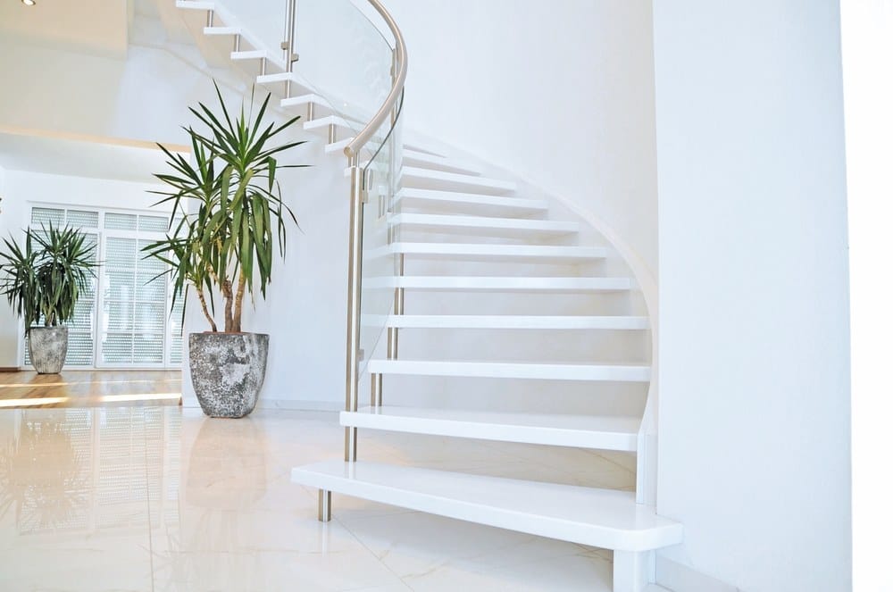 curved stairs with metal railing