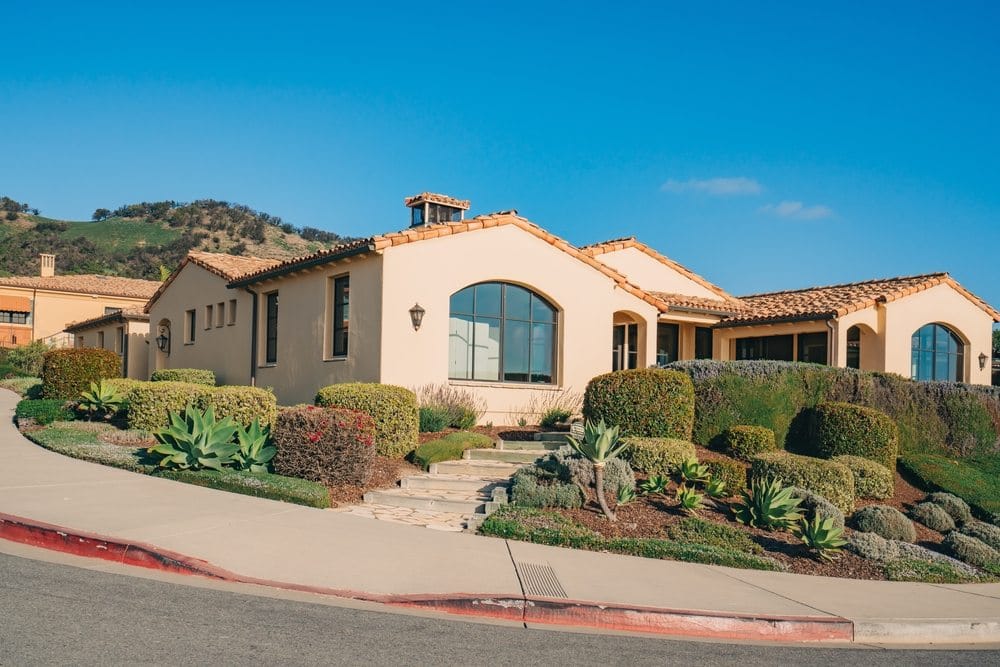 Beautiful houses with nicely landscaped front the yard 